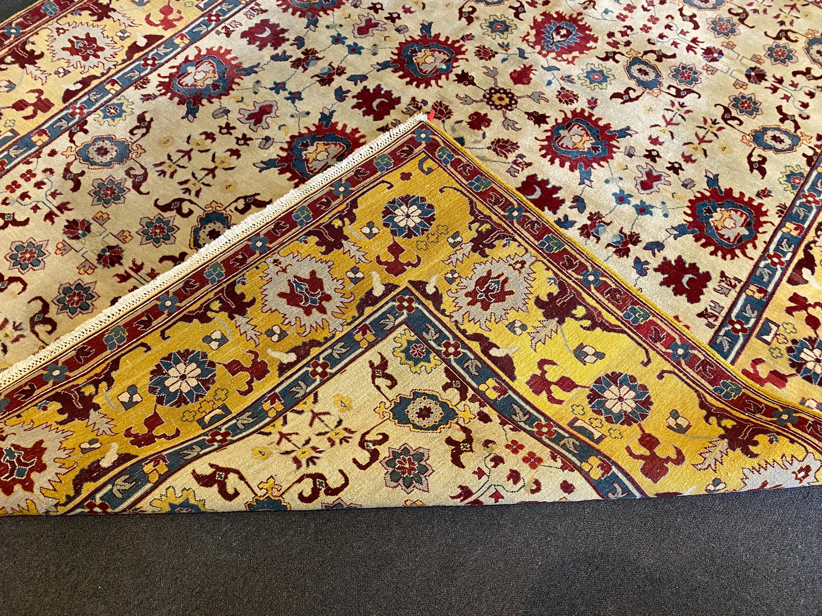 An Agra ivory ground carpet, 360 x 274cm